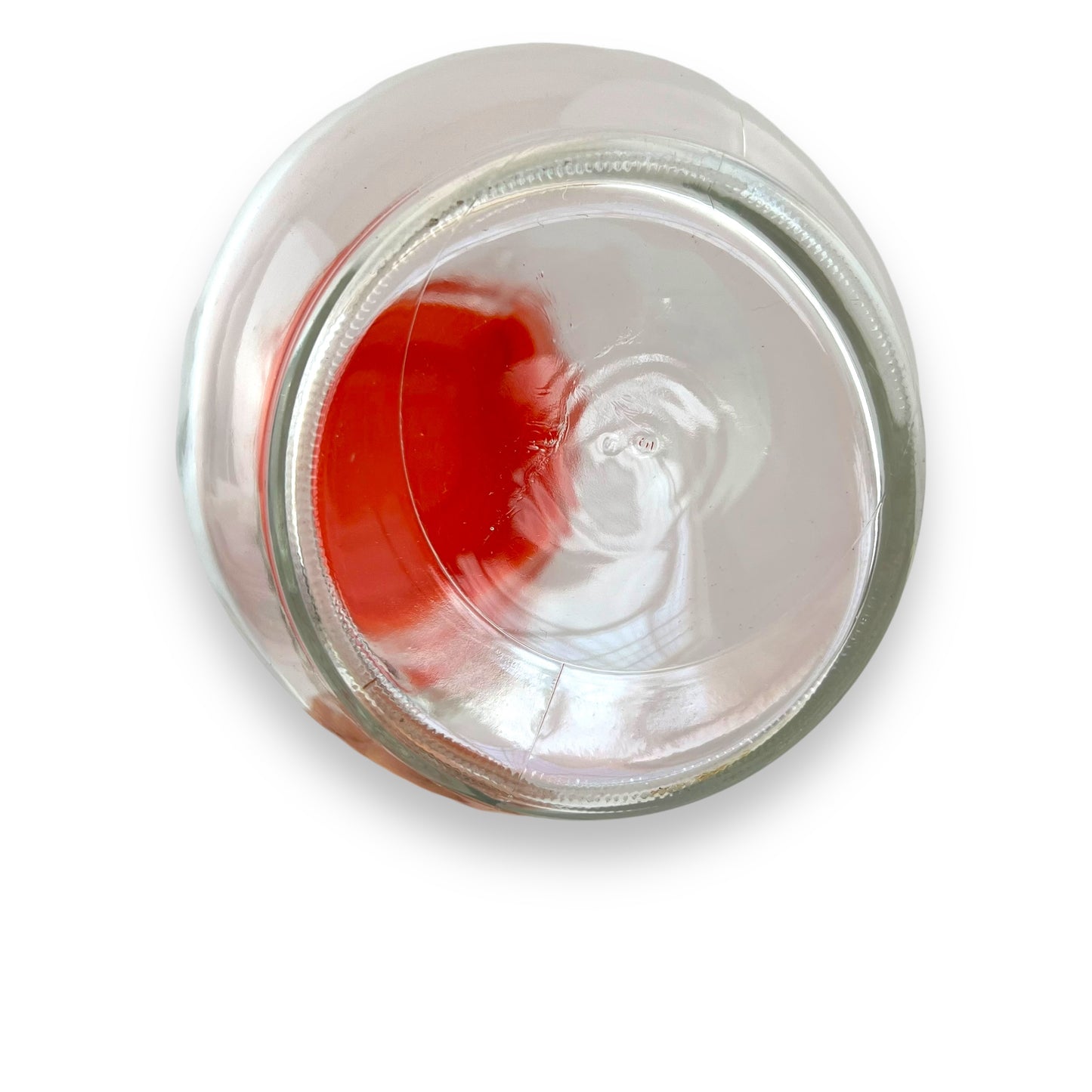 Clear jug with red plastic lid