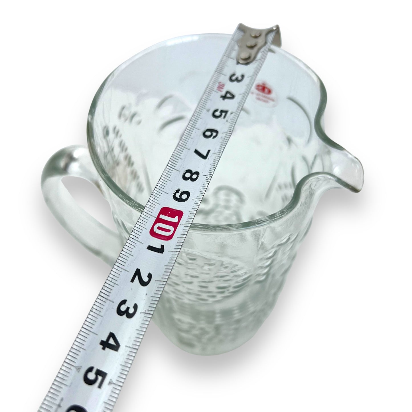 Pressed flower pattern clear glass pitcher