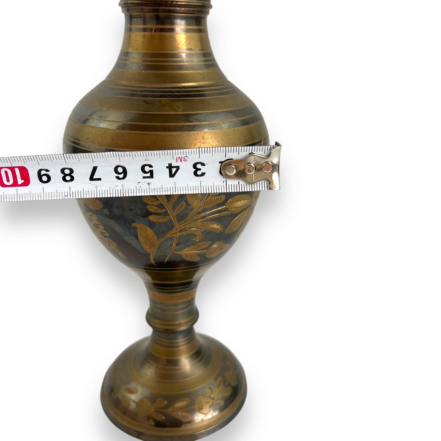 Brass vase with flowers and stripes pattern