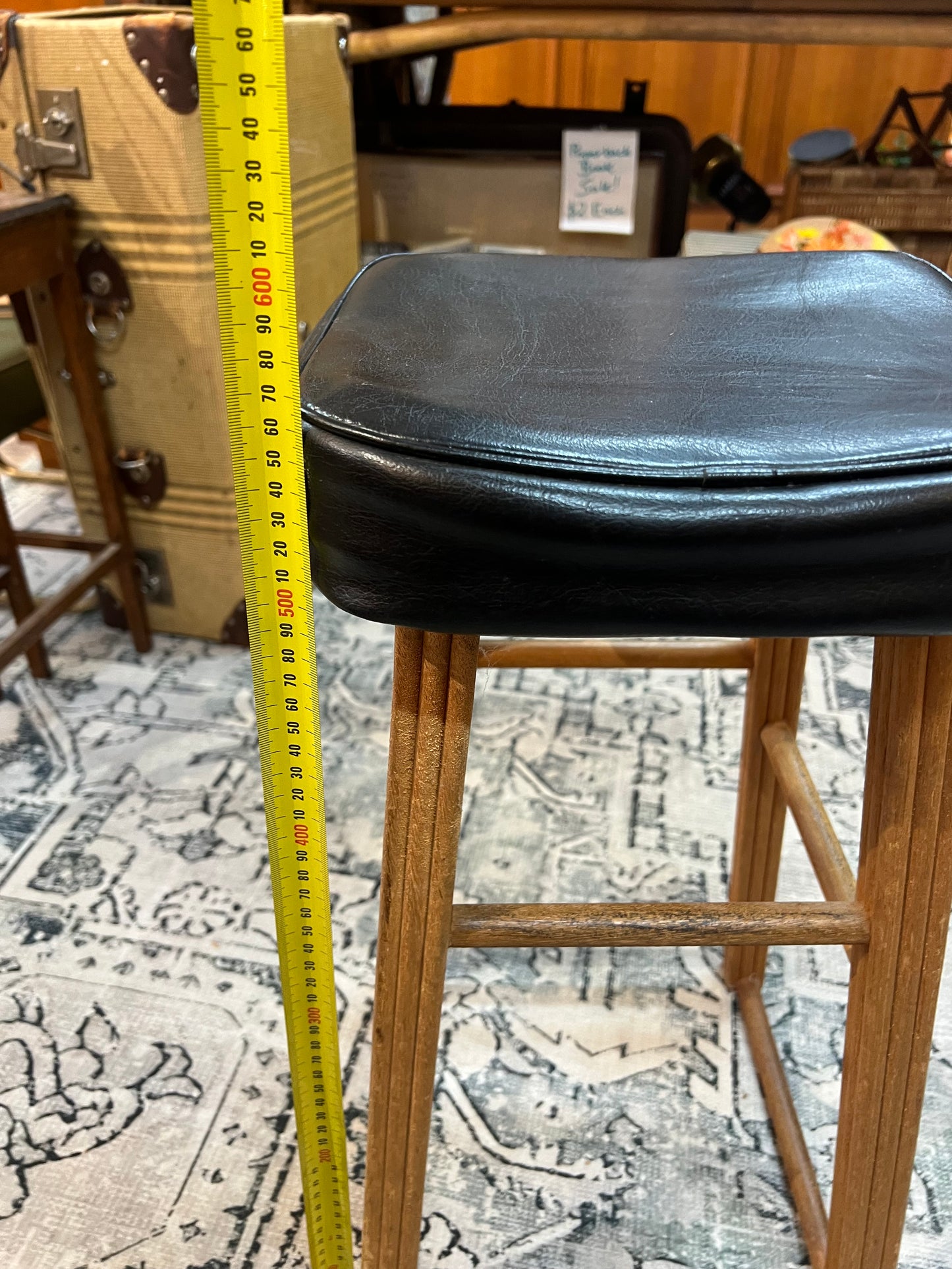 Wooden stool with black top