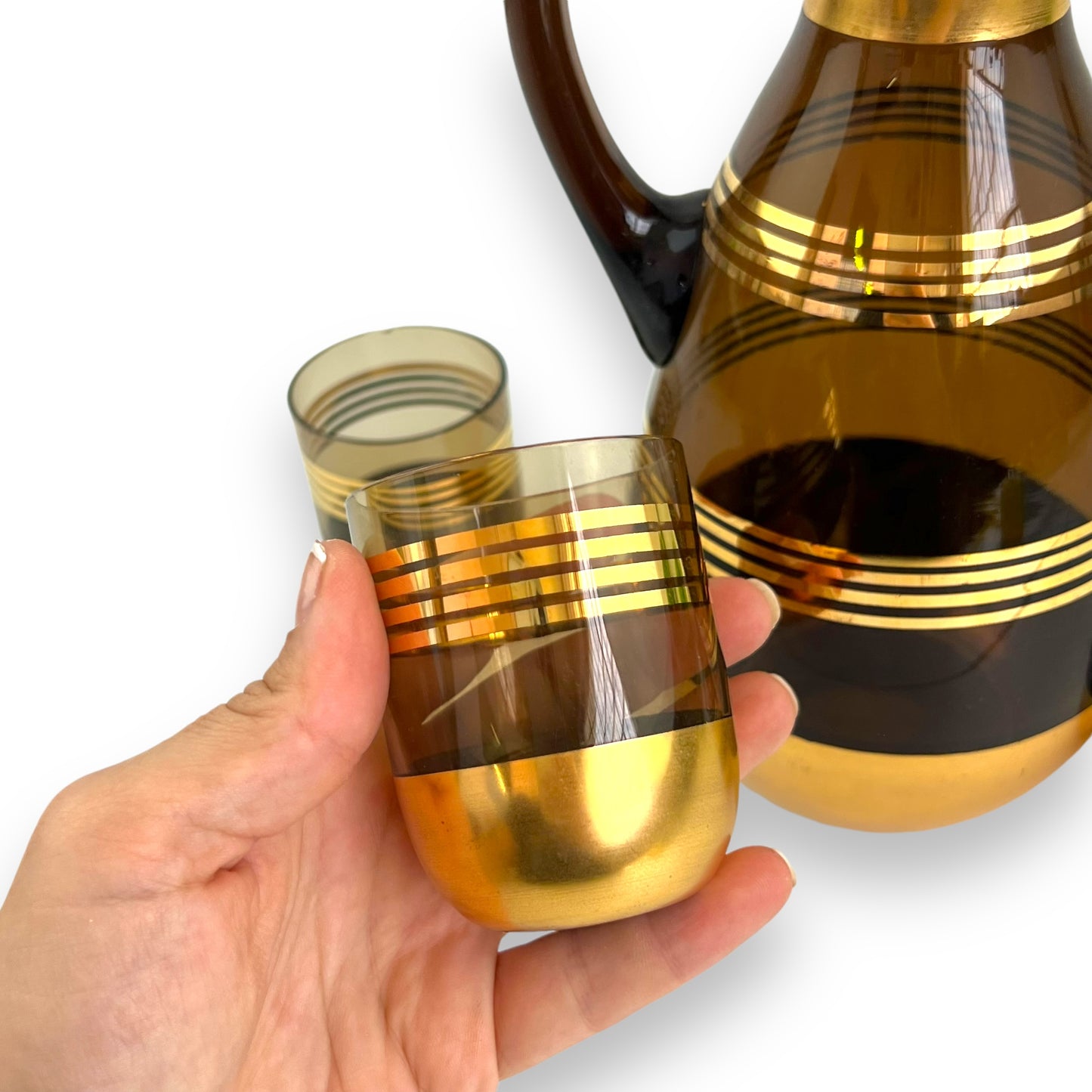 Black Smokey glass gold banded decanter & 4 matching small cups