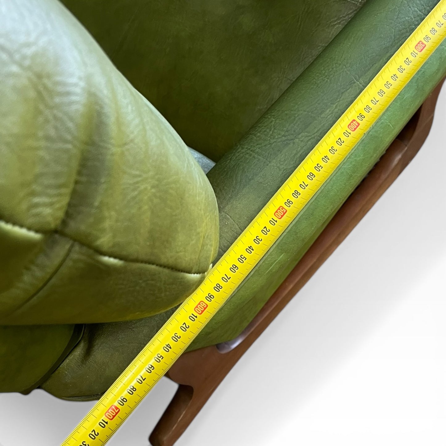 Olive Green Vinyl Lounge Armchair with Timber Sleigh Base
(rip on side)