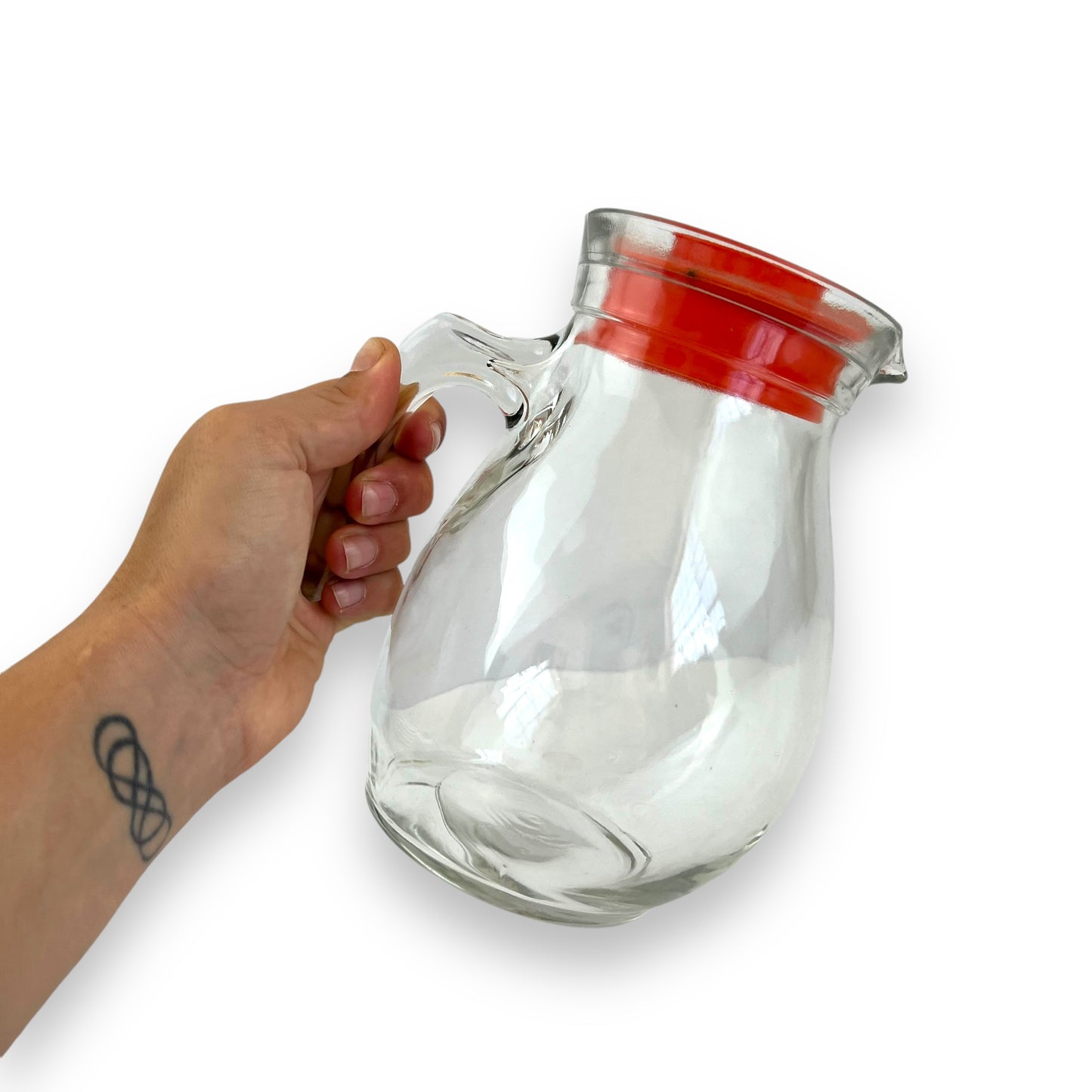 Clear jug with red plastic lid