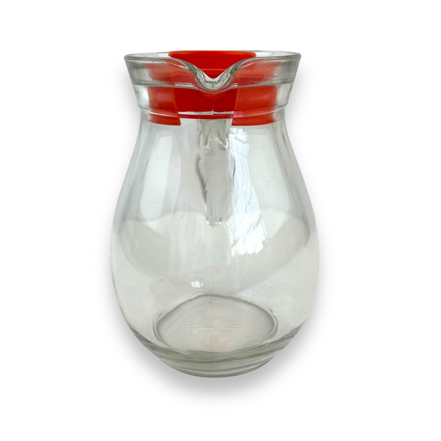 Clear jug with red plastic lid