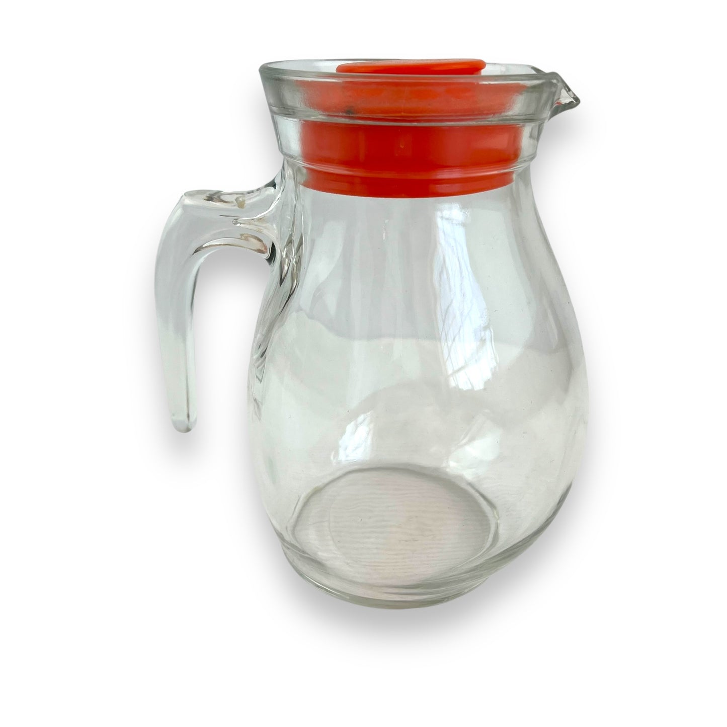 Clear jug with red plastic lid
