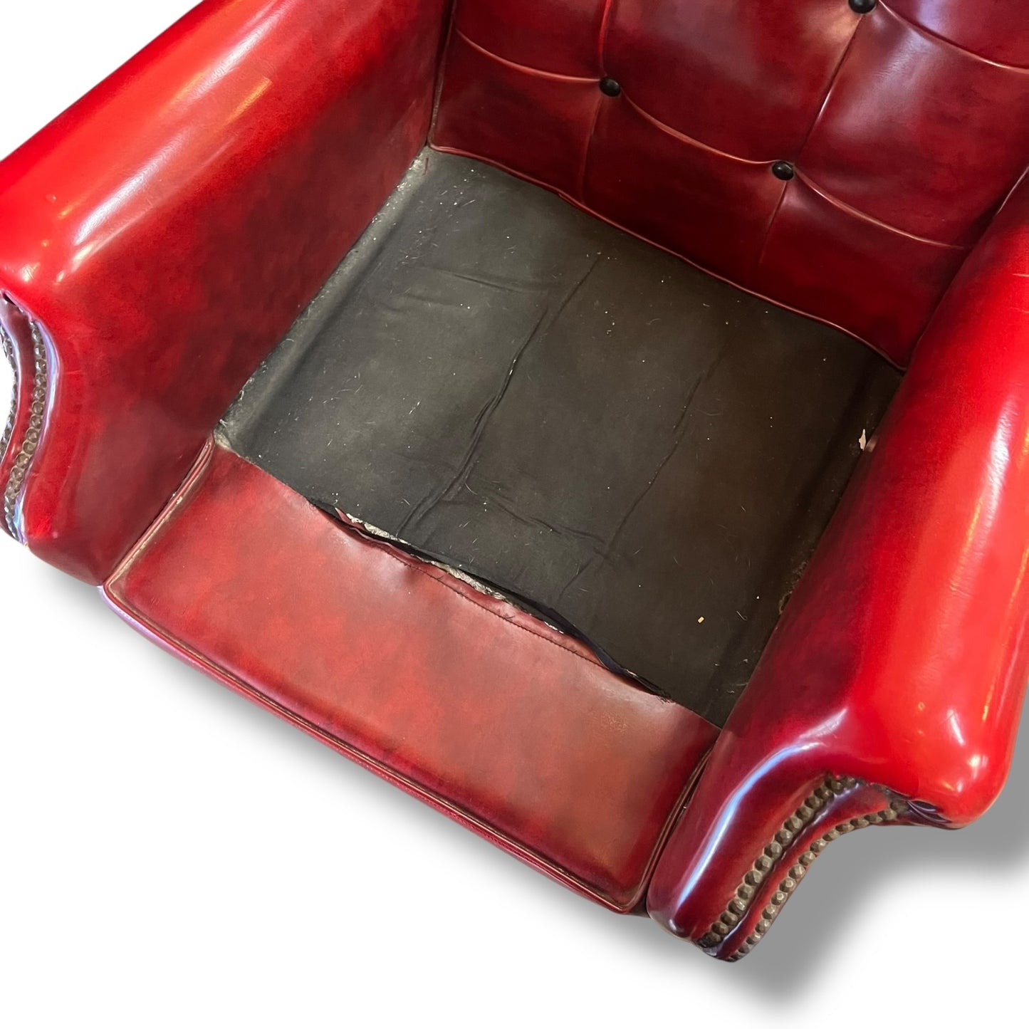Red Wingback Armchair with Stud Detailing