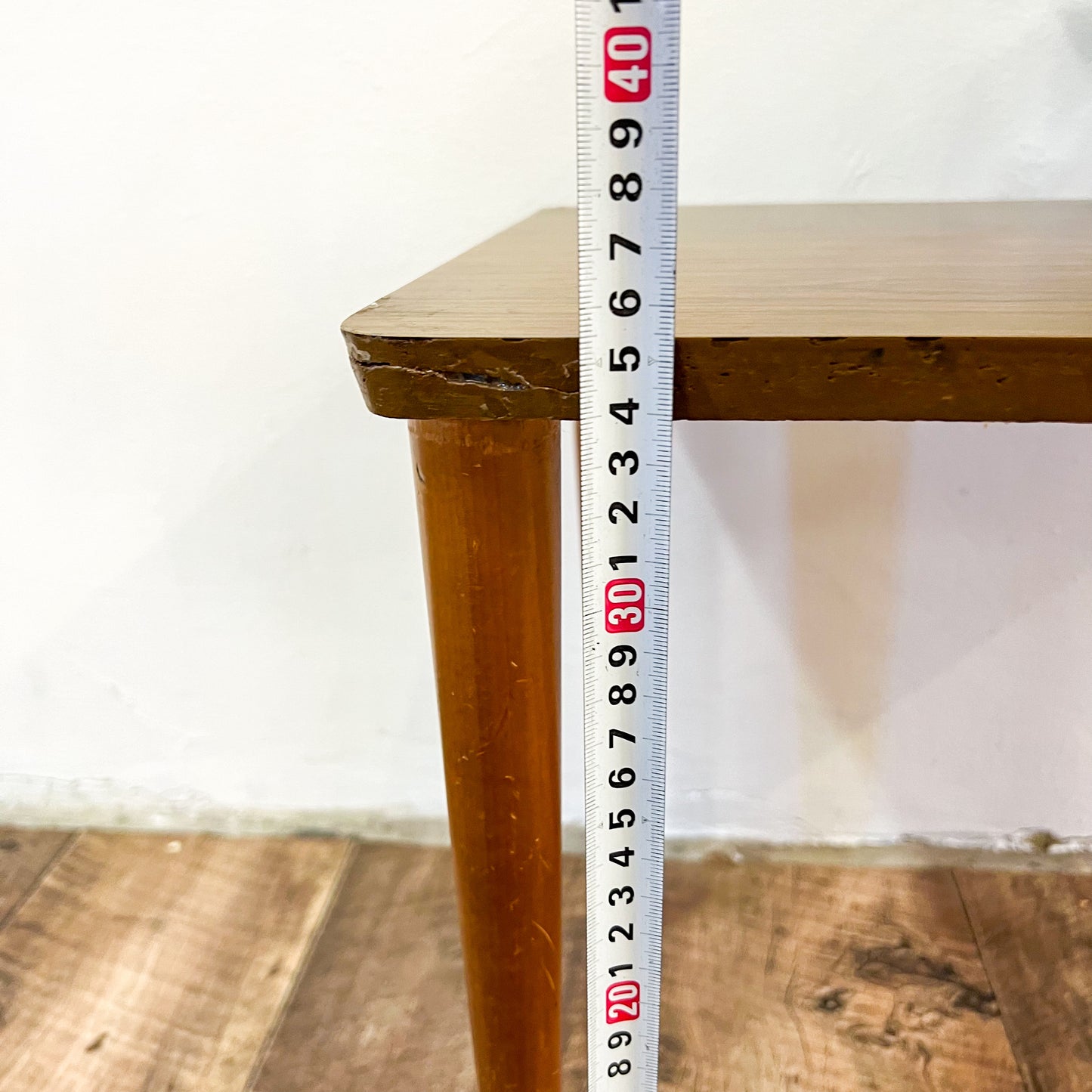 Small brown laminate side table
