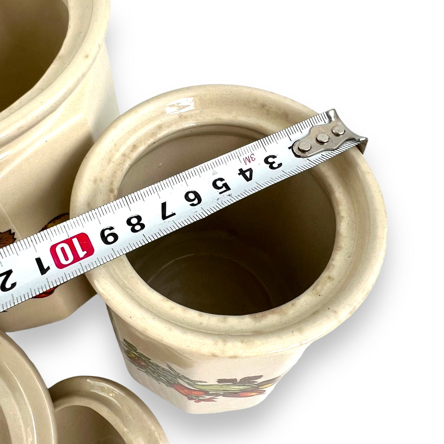 Beige Ceramic Canister set of 3 with colourful vegetable decals.