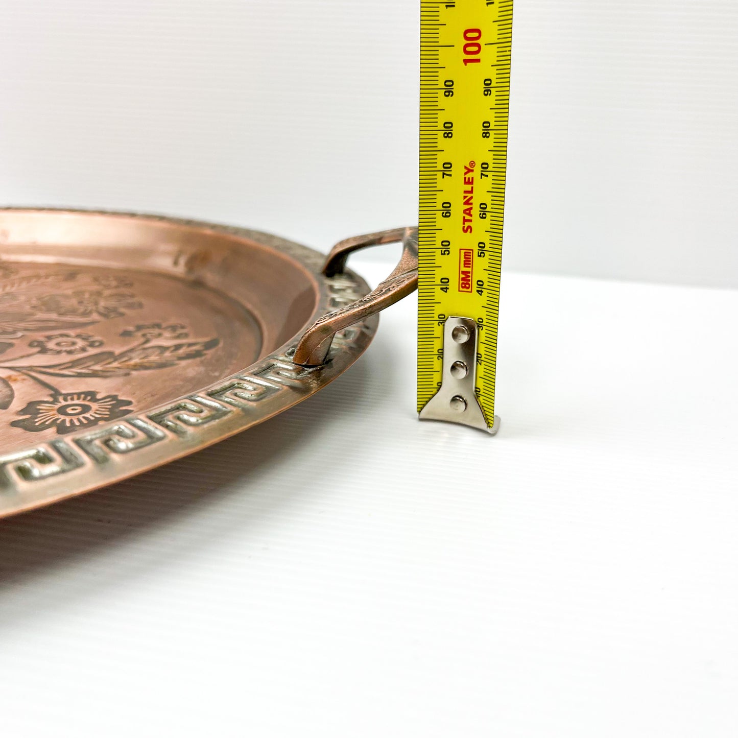 Copper colour metal round drink serving tray with flower artwork design