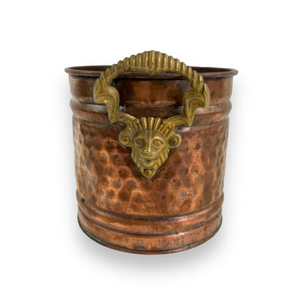 Brass and copper lion head plant pot