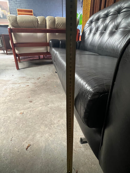Black Button-Tufted Three-Seater Lounge with Chrome Legs