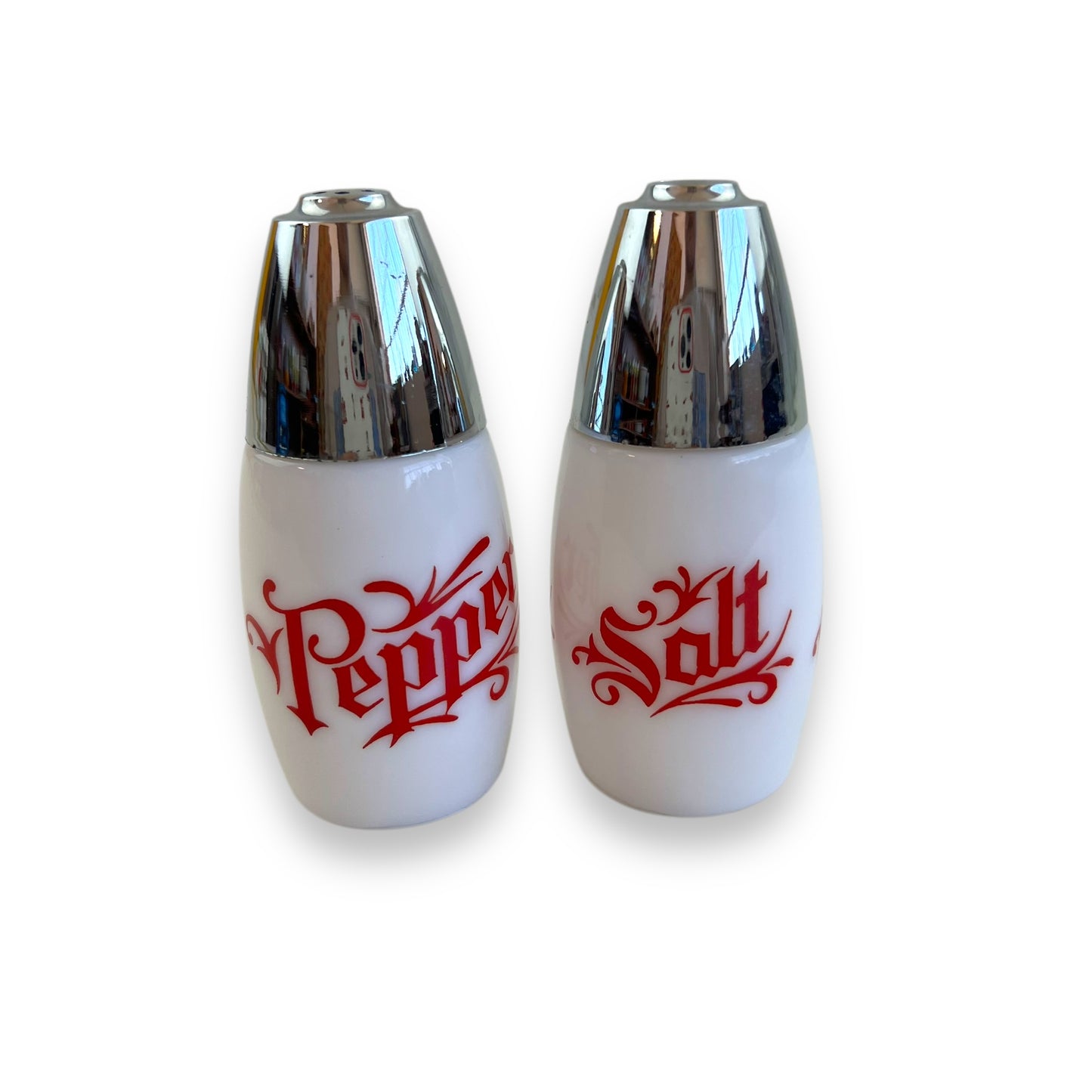 White with red writing and chrome top salt and pepper shaker set