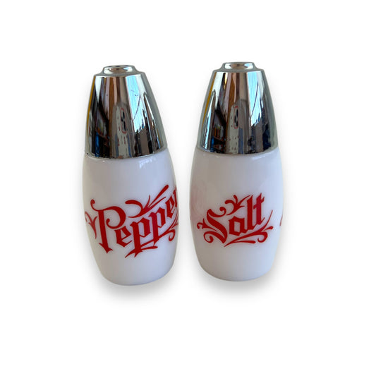 White with red writing and chrome top salt and pepper shaker set