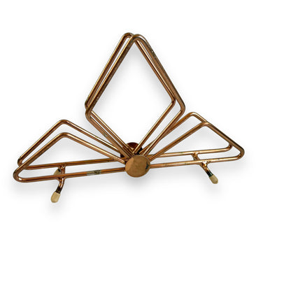 Copper coloured triangle design letter / napkin holder