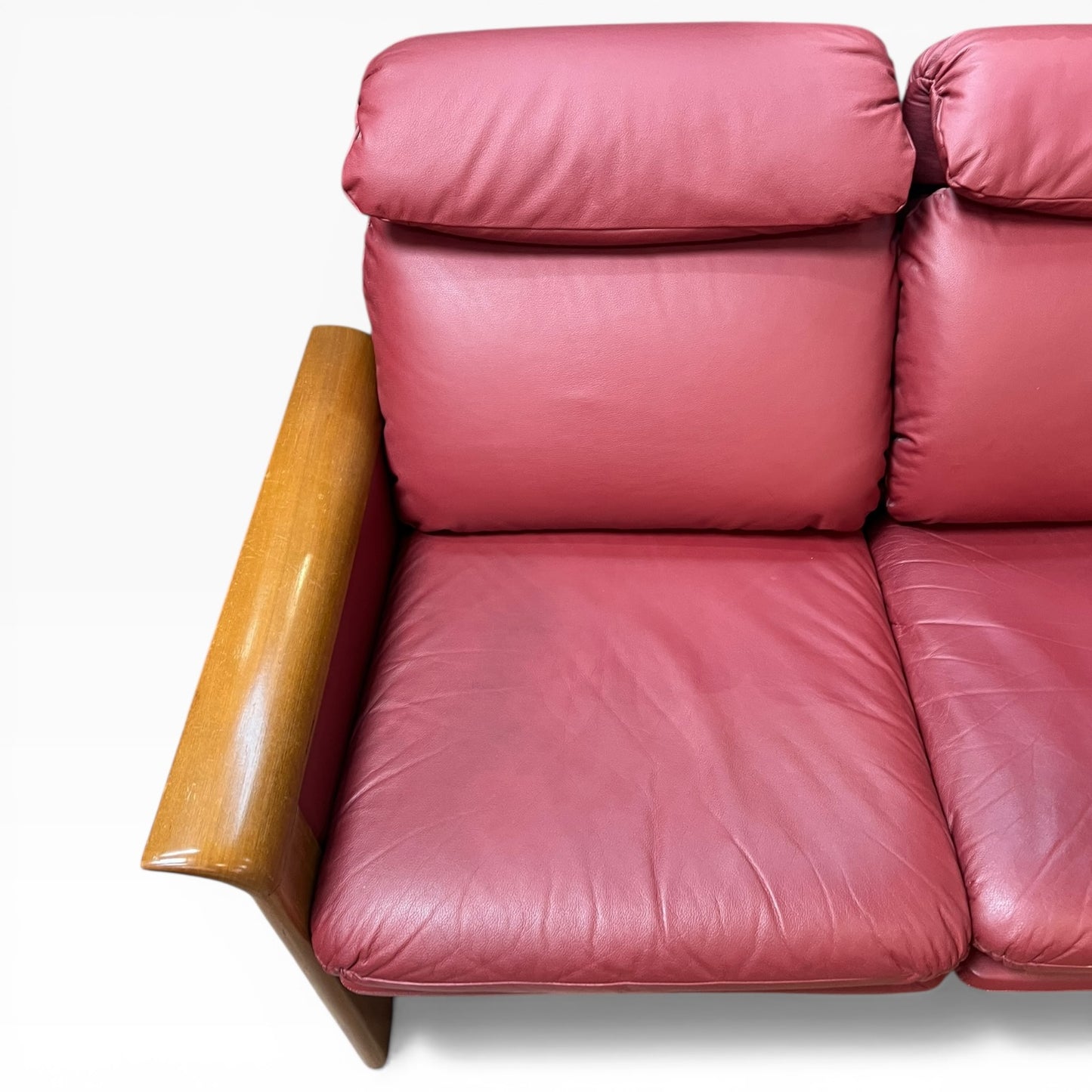 Two Seater Lounge with Sculpted Curved Timber Armrests & Burgundy Leather Cushions