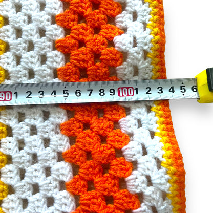 Orange, yellow and white crochet knit blanket
