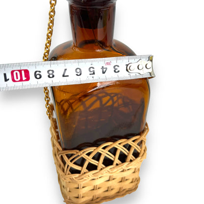 Amber glass decanter bottle with cane base and cork stopper