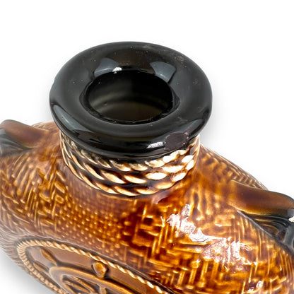 Brown Ceramic Decanter with Ship and wheel design.