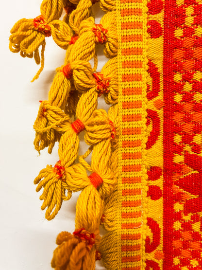 Large orange and yellow patterned wool rug