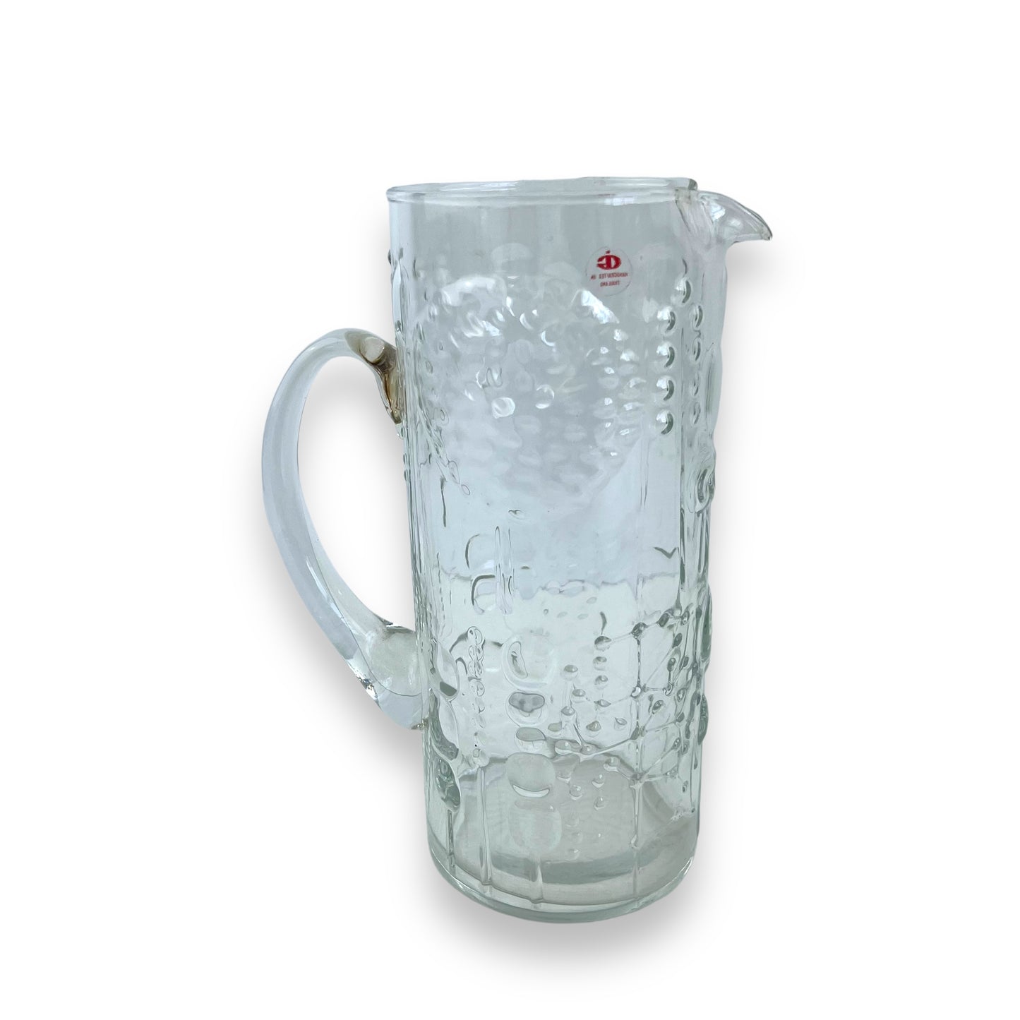 Pressed flower pattern clear glass pitcher