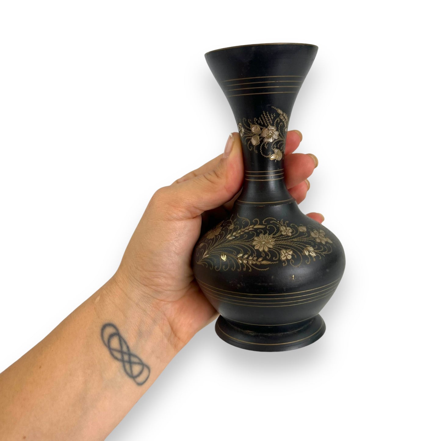 Black metal vase with gold etched flower design