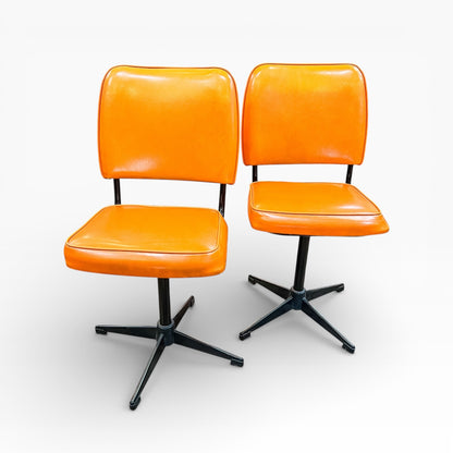 Pair of Vintage Swivel Chairs – Orange Vinyl & Black Star Base