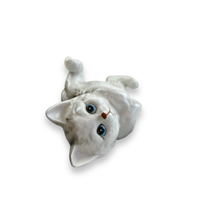 Cat laying on back ornament statue