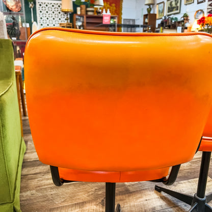Pair of Vintage Swivel Chairs – Orange Vinyl & Black Star Base