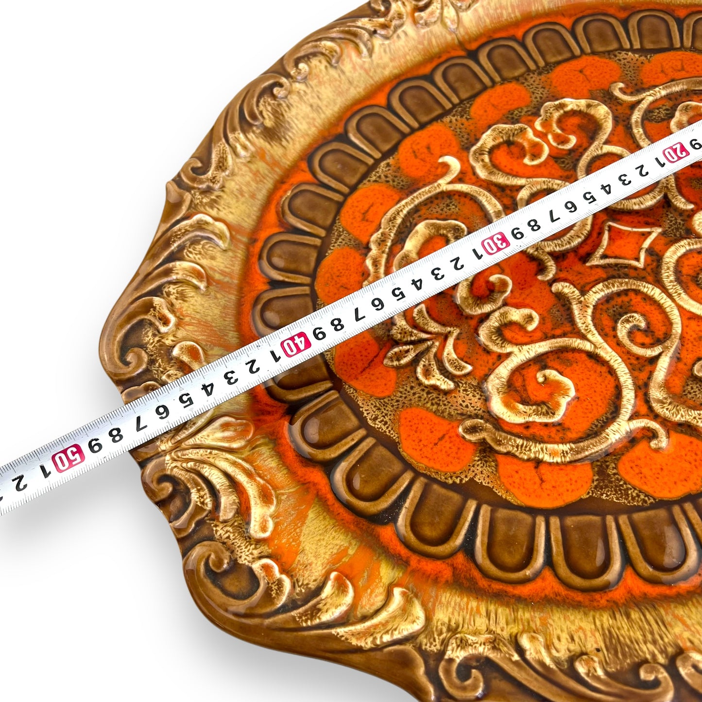 Large orange and brown ornate ceramic serving platter