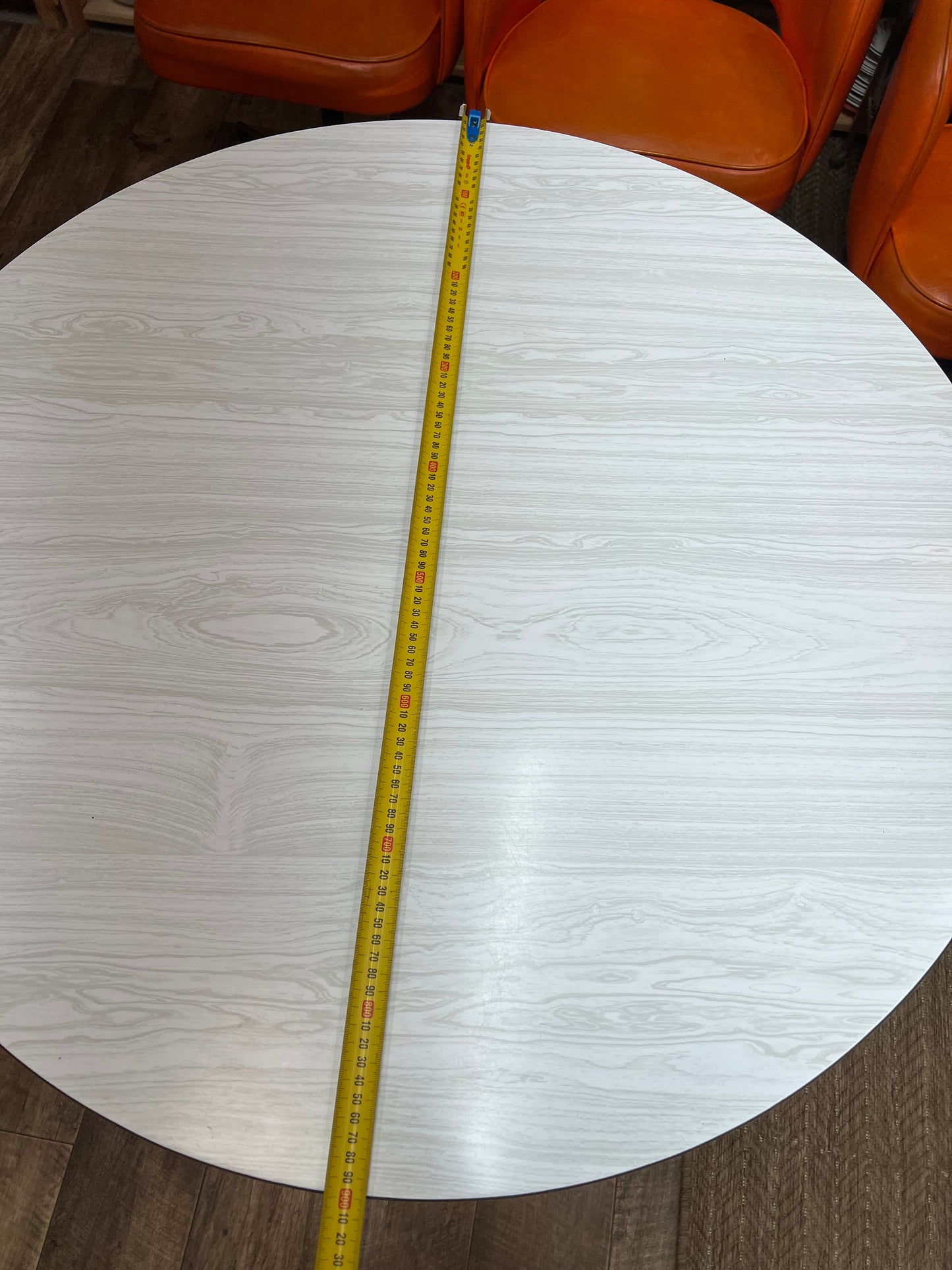 Namco Round Mid Century Dining Table with White Woodgrain Laminate Top and black steel legs