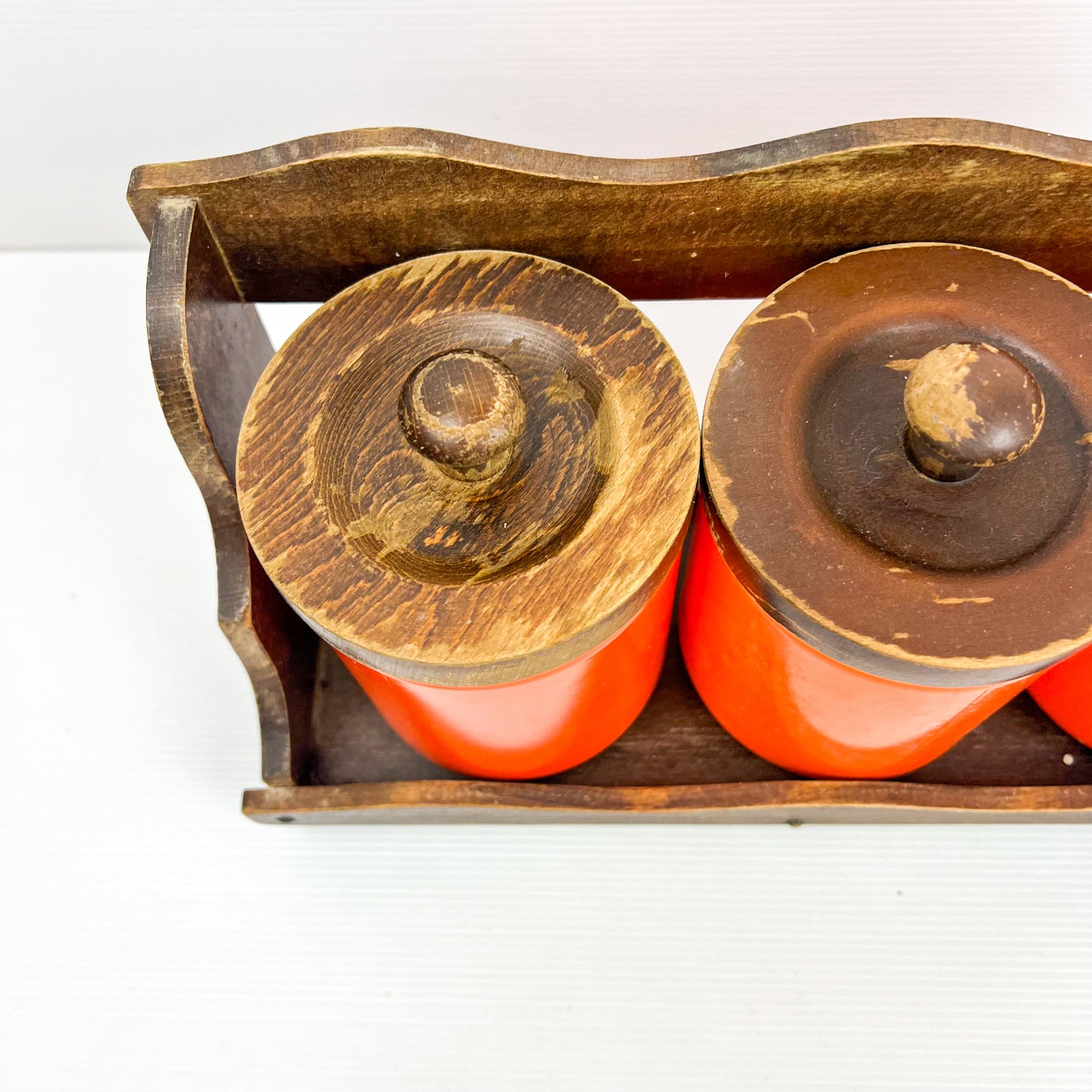 Orange Kitchen Storage Canister Jars with wooden lids and wooden hanging shelf