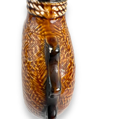 Brown Ceramic Decanter with Ship and wheel design.