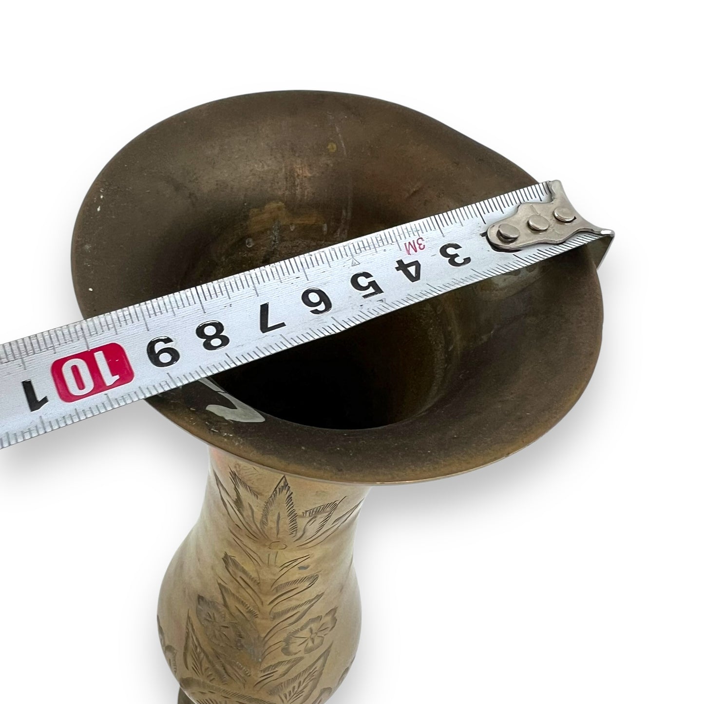 Tall brass vase with etched flower design