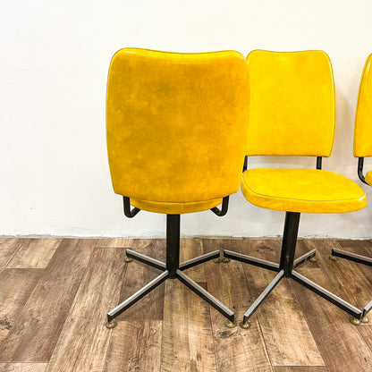 Retro yellow swivel dining chair