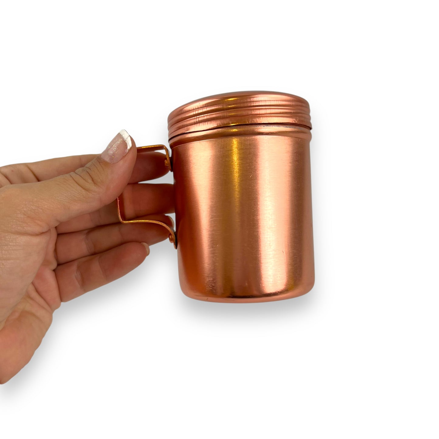 Rose gold coloured metal condiment shaker