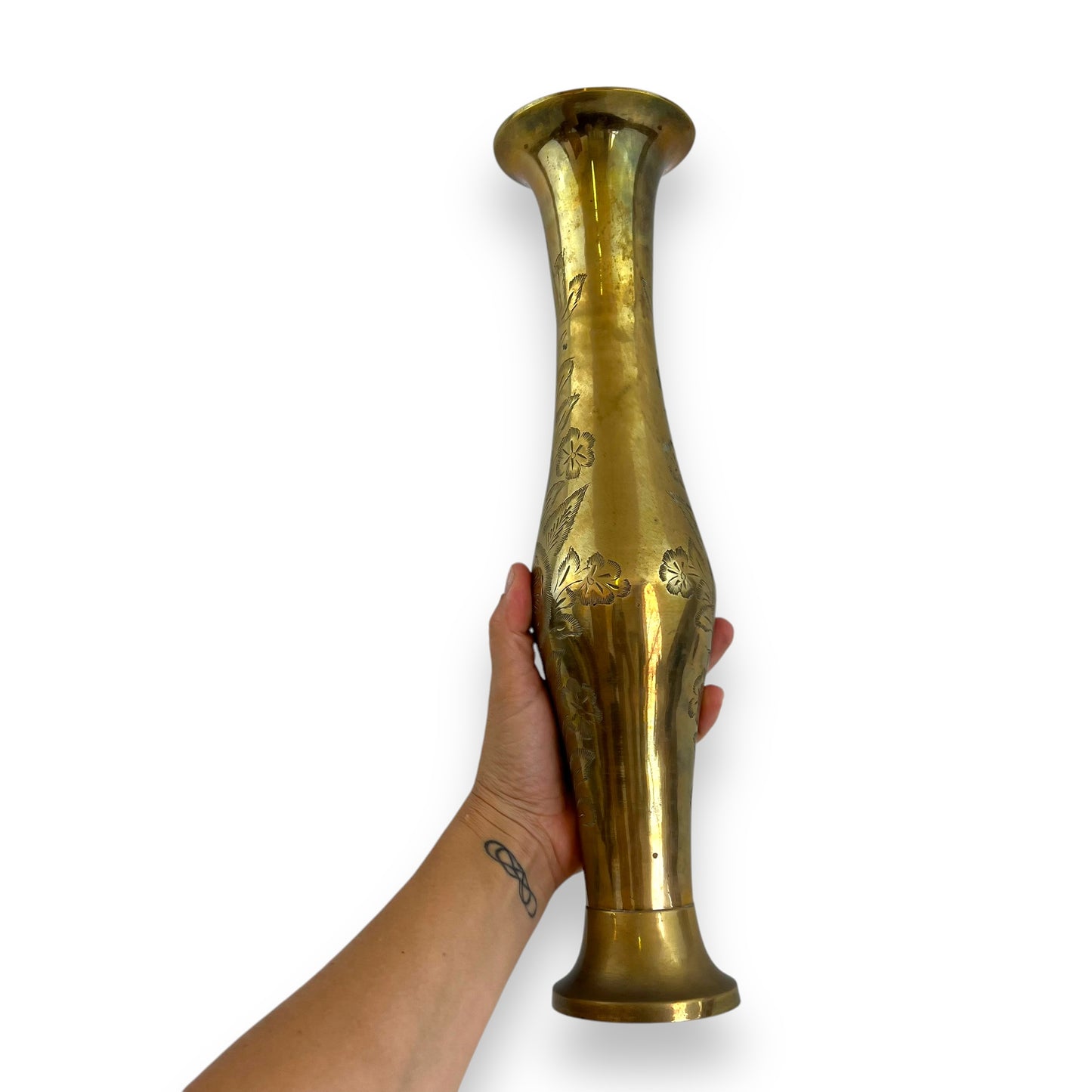 Tall brass vase with etched flower design