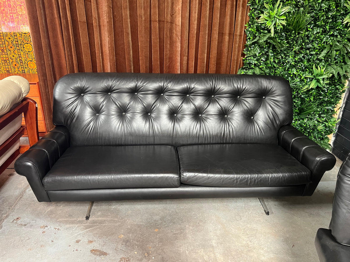 Black Button-Tufted Three-Seater Lounge with Chrome Legs