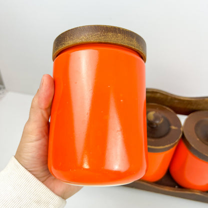 Orange Kitchen Storage Canister Jars with wooden lids and wooden hanging shelf