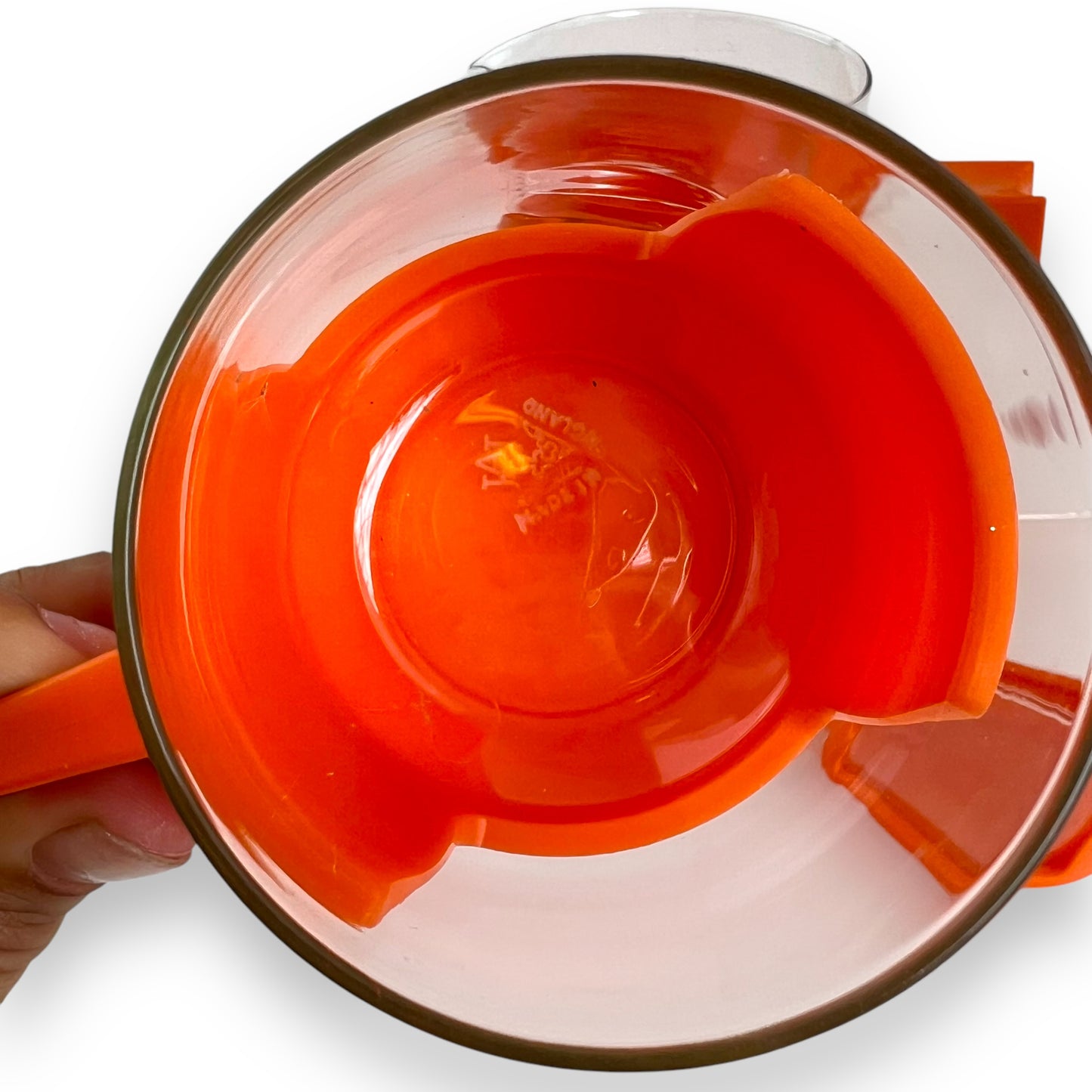 JAJ Pyrex Clear glass jug & 3 cups with orange plastic handles and lid.