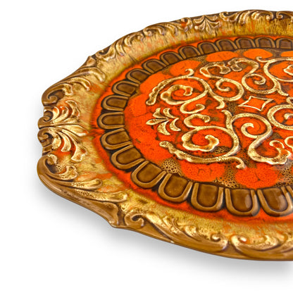 Large orange and brown ornate ceramic serving platter