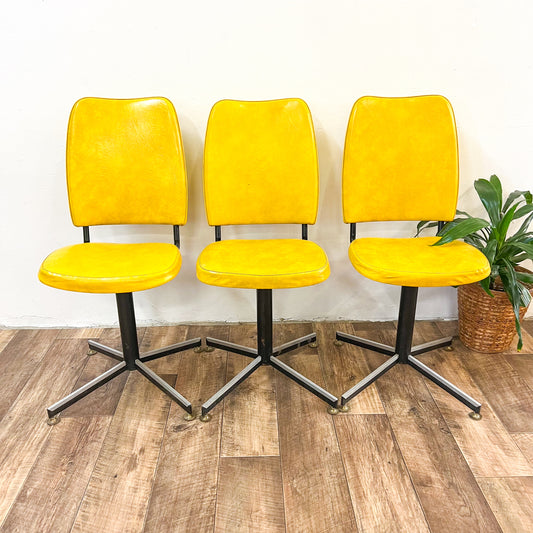 Retro yellow swivel dining chair