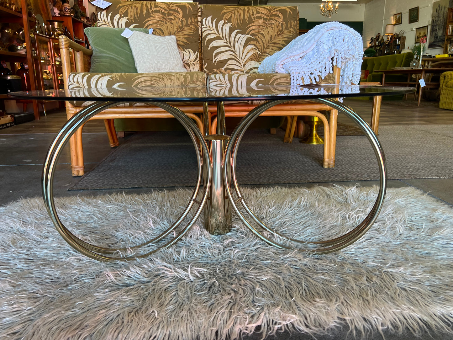 Hollywood Regency Brass & Smoked Glass Coffee Table – Sculptural Triple Ring Base, c.1970s