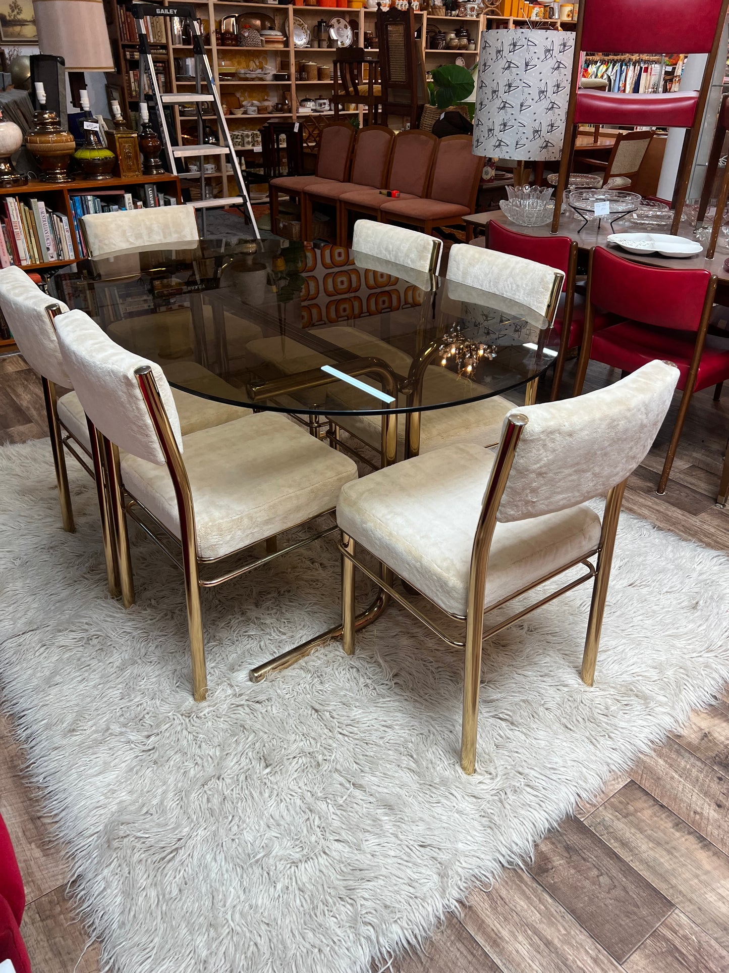 Brass & Smoked Glass Dining Table with 6 Chairs cream upholstery