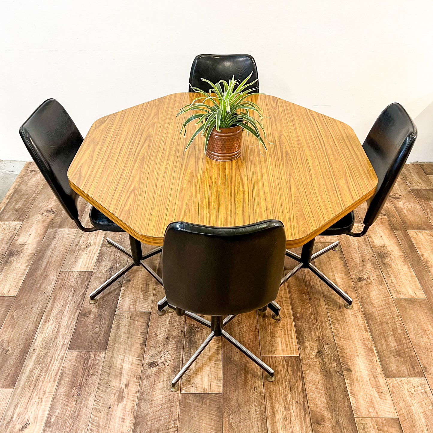 Brown Laminate Octagon Dining Table and 4 Black swivel dining chairs
