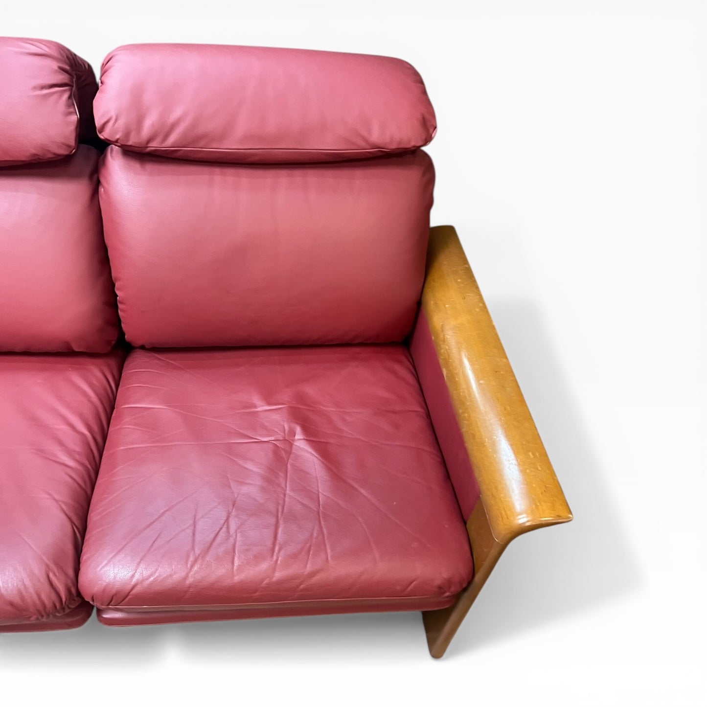 Two Seater Lounge with Sculpted Curved Timber Armrests & Burgundy Leather Cushions