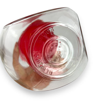 Red lid round glass storage jar