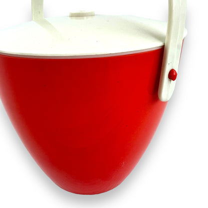 Orange red plastic ice bucket with tongs
