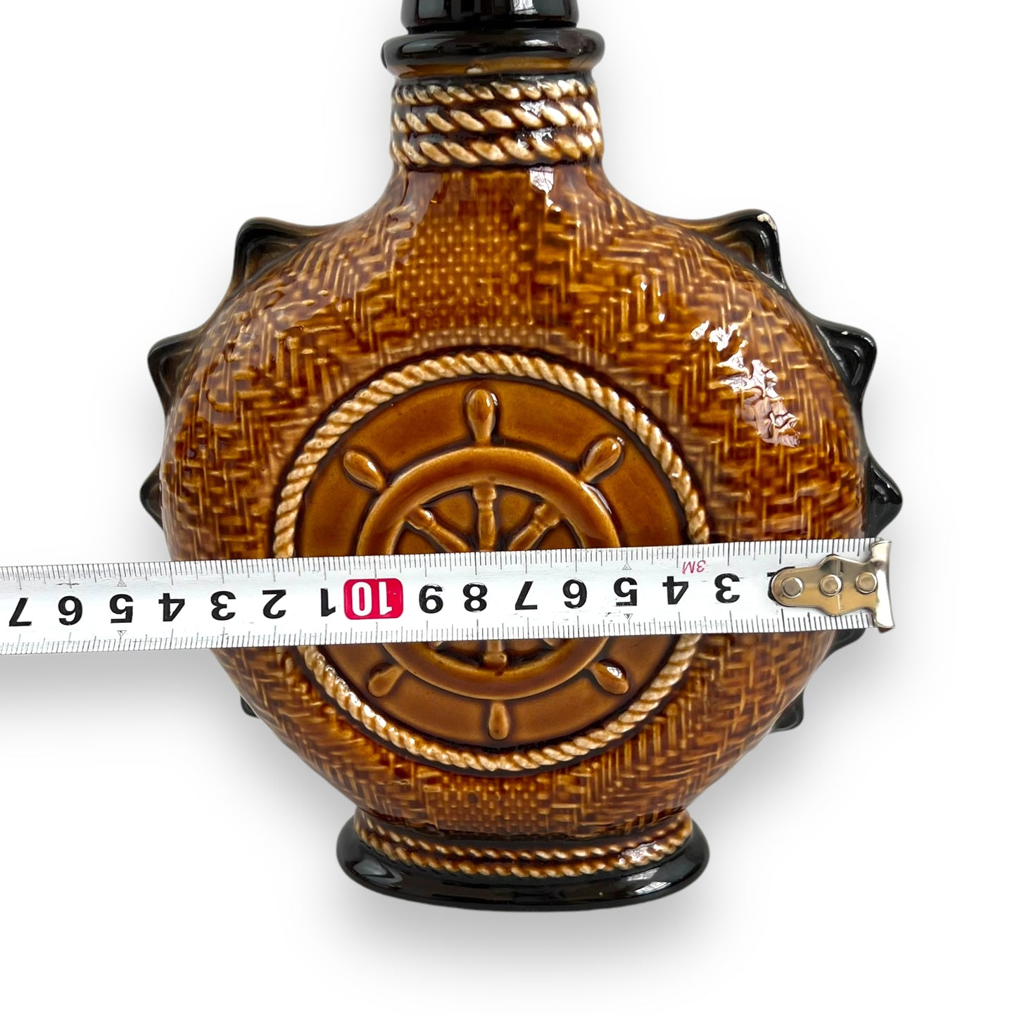 Brown Ceramic Decanter with Ship and wheel design.