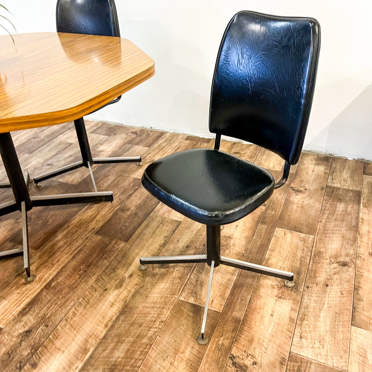 Brown Laminate Octagon Dining Table and 4 Black swivel dining chairs