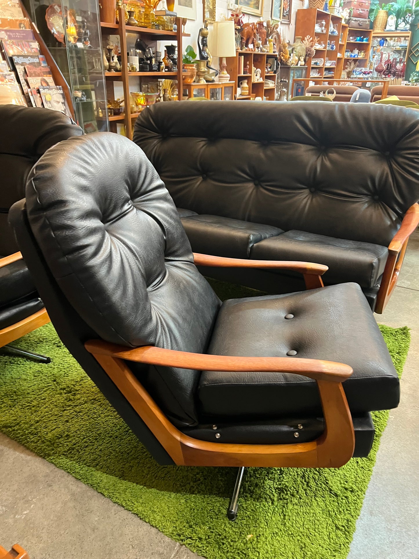 2. Black Vinyl Swivel Armchair with Timber Arms